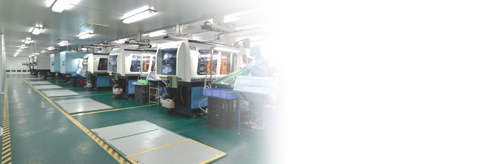 Plastic injection molding machines in a controlled factory workshop